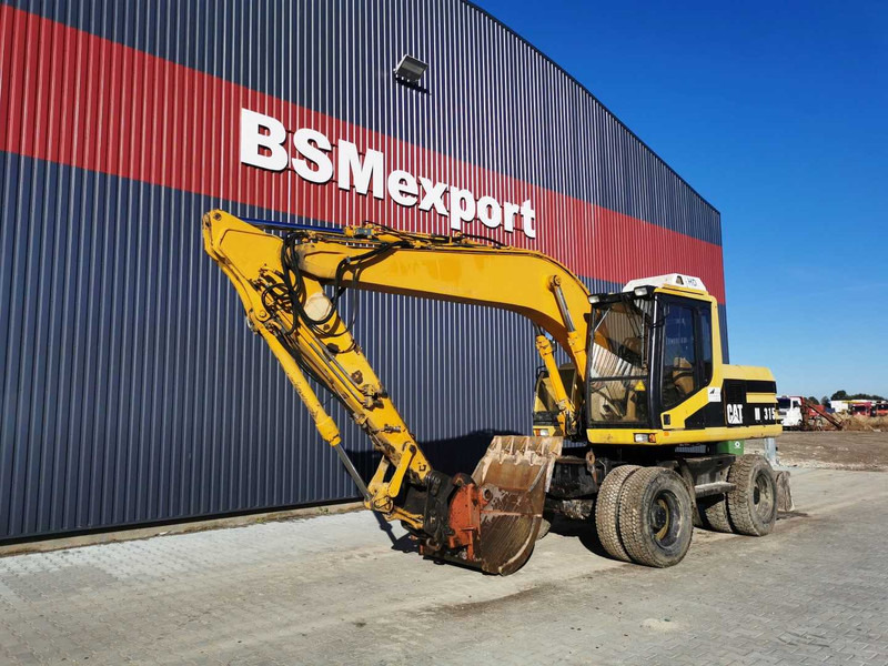 Caterpillar M315 wheel excavator - Mobilbagger: das Bild 2 Caterpillar M315 wheel excavator - Mobilbagger: das Bild 2