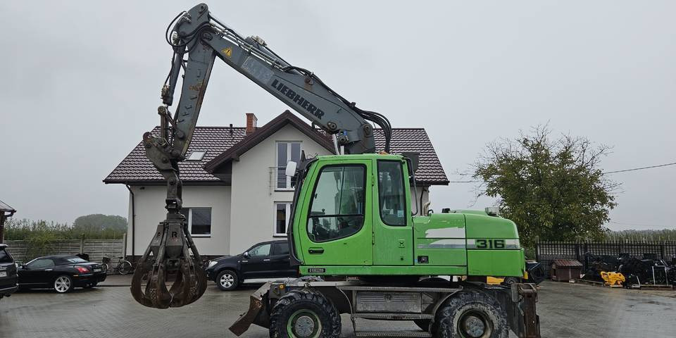Koparka kołowa Liebherr A 316 Litronic chwytak podpory pług - Mobilbagger: das Bild 1 Koparka kołowa Liebherr A 316 Litronic chwytak podpory pług - Mobilbagger: das Bild 1