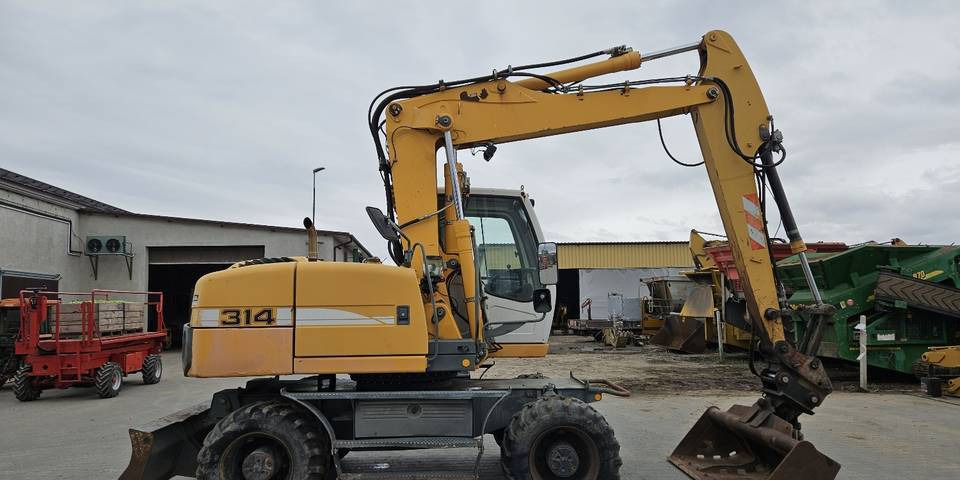 Koparka kołowa Liebherr A314 Litronic 9350 h+ 5 łyżek kołówka - Mobilbagger: das Bild 5 Koparka kołowa Liebherr A314 Litronic 9350 h+ 5 łyżek kołówka - Mobilbagger: das Bild 5