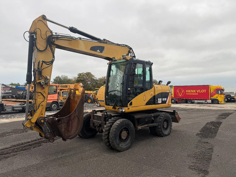 Caterpillar M313D 7212 HOURS - Mobilbagger: das Bild 1 Caterpillar M313D 7212 HOURS - Mobilbagger: das Bild 1
